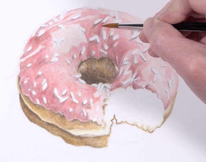 Darkening shadows on the frosting of the doughnut